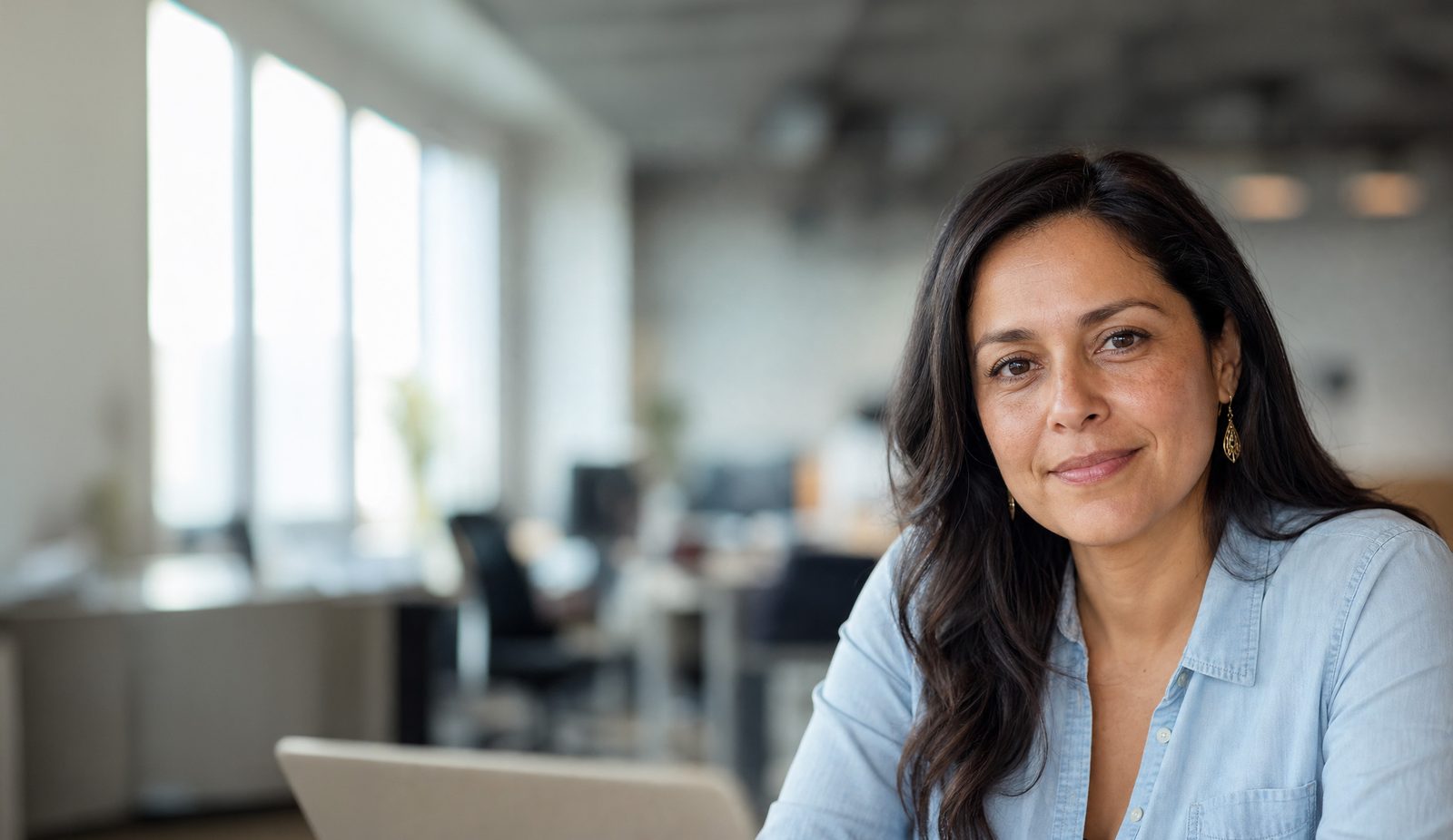 Latina woman at office desk